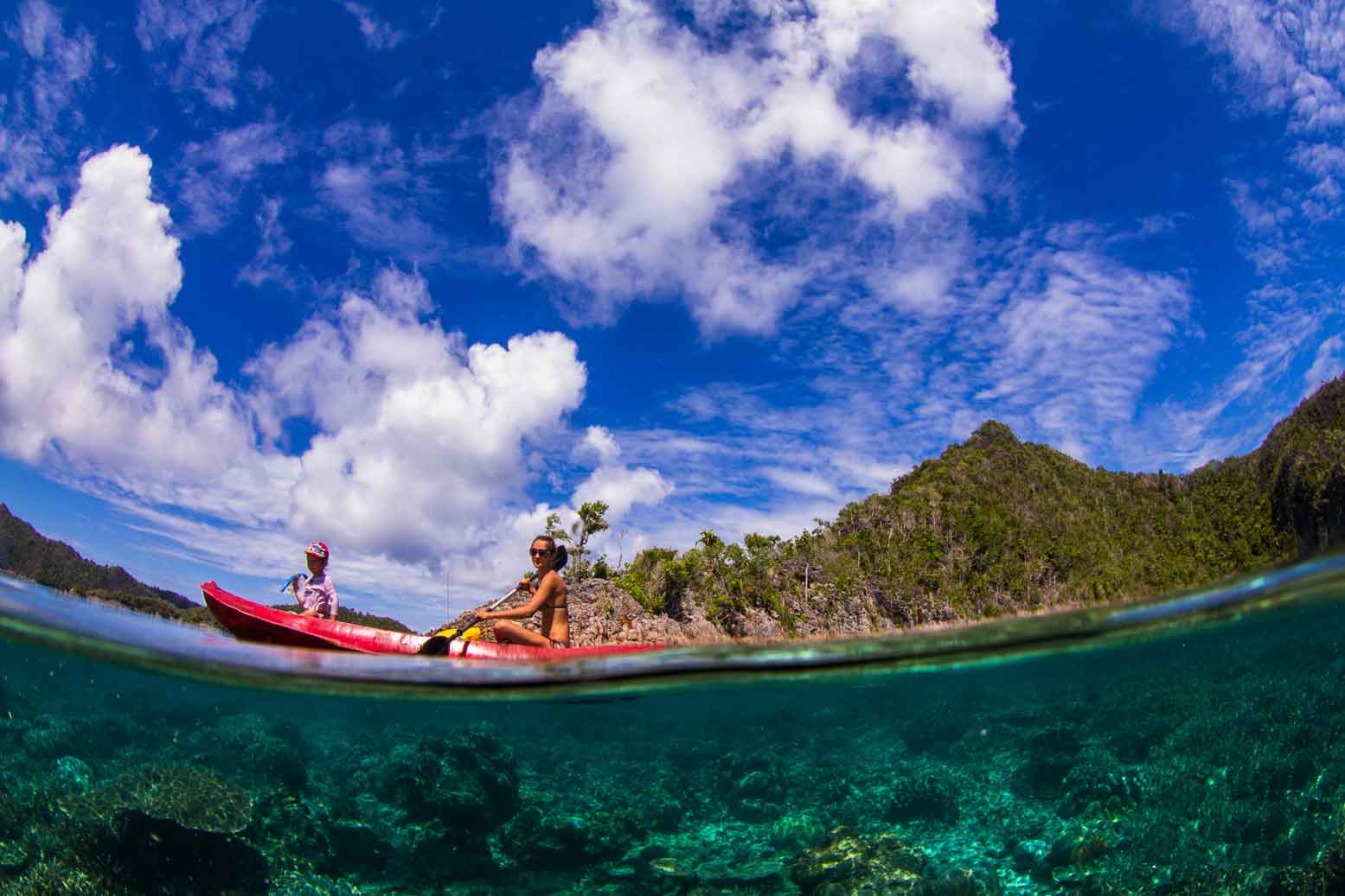 Paddling through the crystal clear lagoons of Raja Ampat